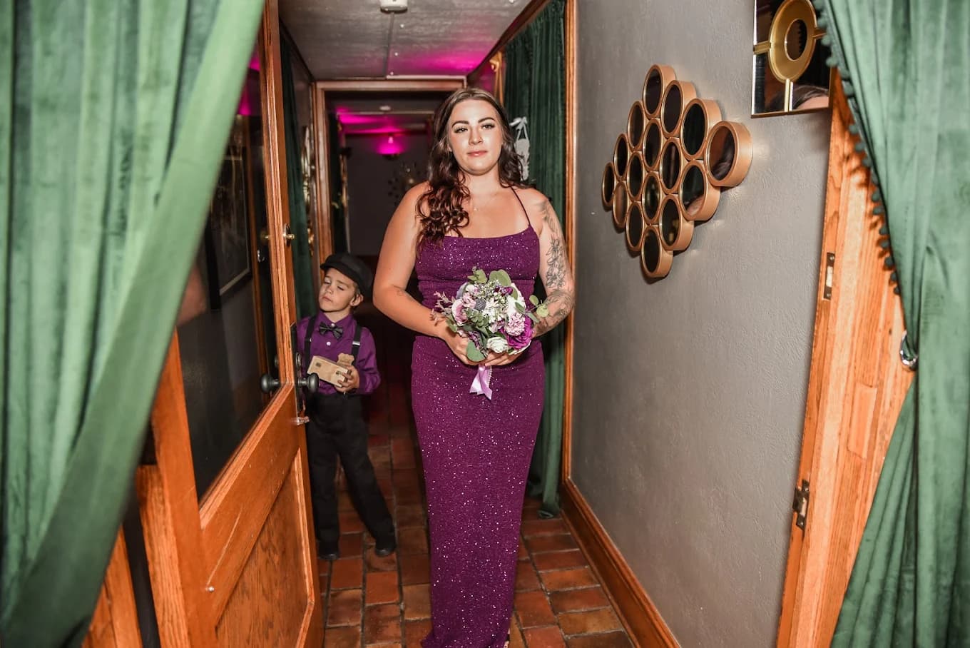 Bride walking through emerald curtain hallway at Nineteen 25 Denver Private Event Venue
