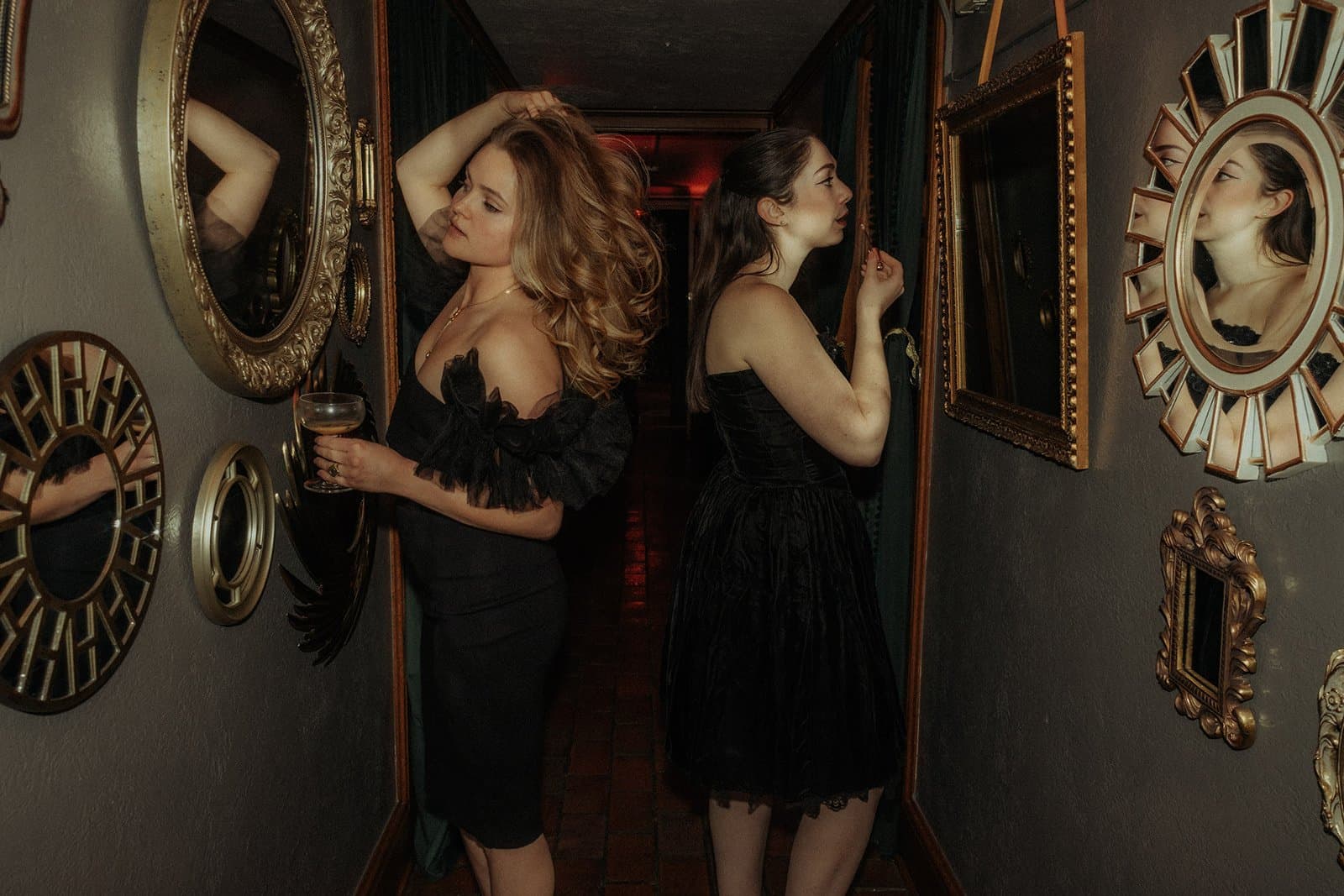 Nineteen 25 Denver Private Event Venue - elegant guests in the iconic mirror hallway with ornate gold frames